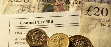 Council tax bill with money